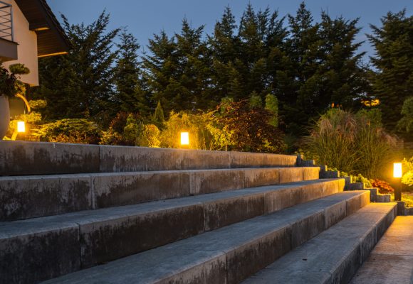 Large Garden Concrete Stairs and Illuminated Rockery Garden. Residential Architecture.
